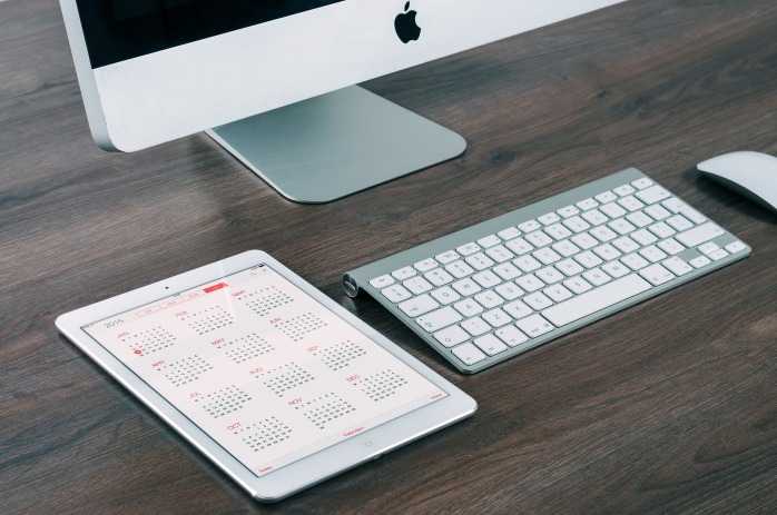imac, ipad, desk and calendar