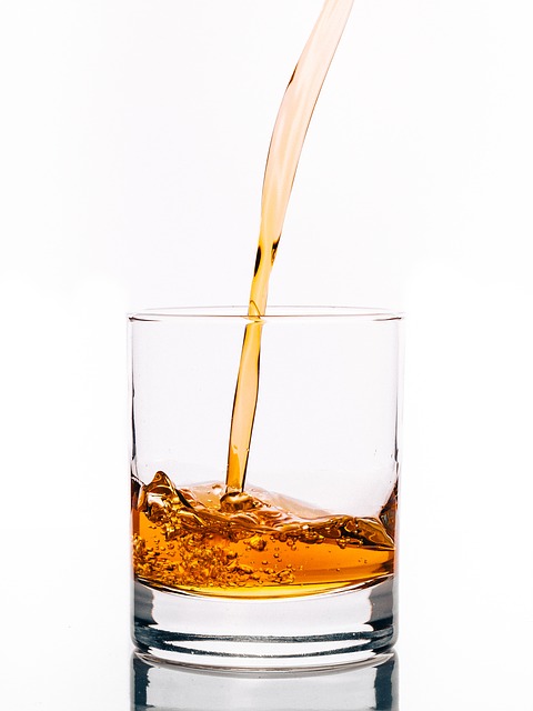 whisky being poured into a glass